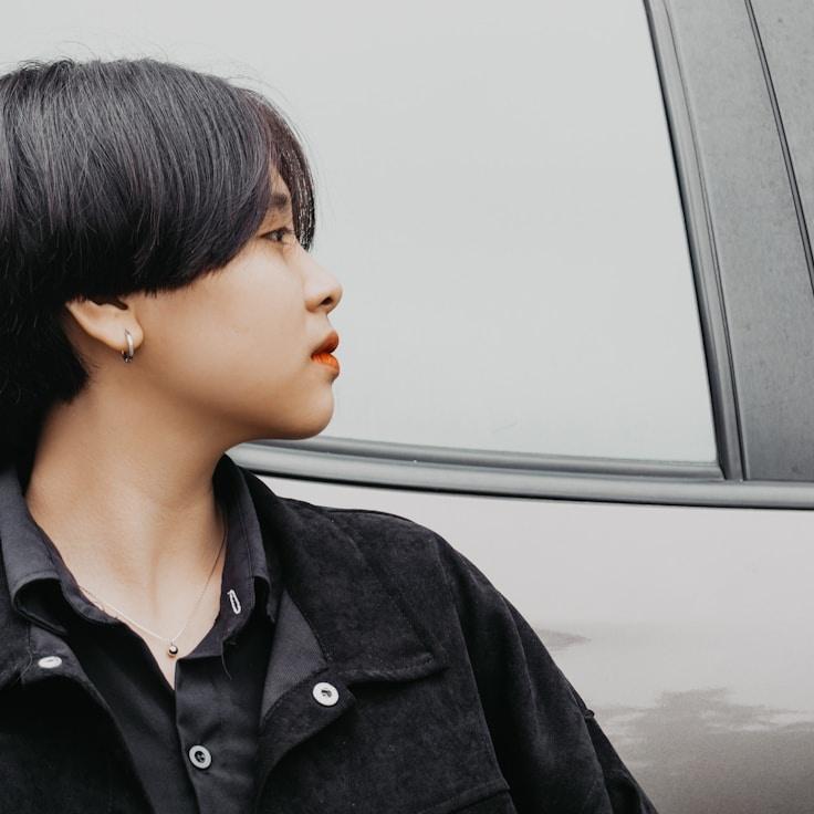 Lila Rao, Lead Design Curator at Tranquil Harbor Group, reviewing corporate floral arrangements